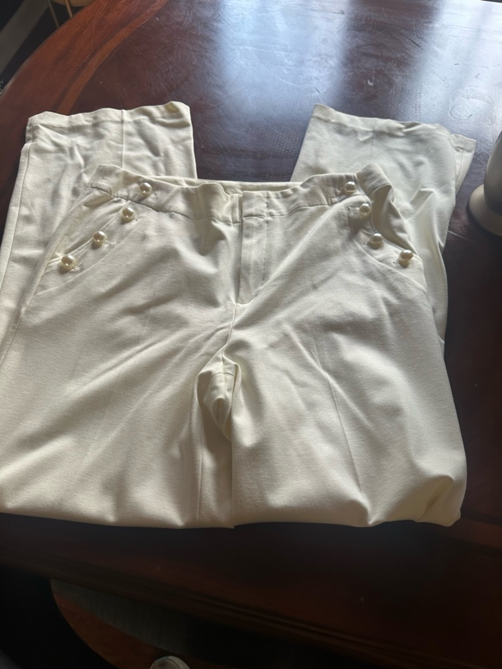 Ladies cream dress pants with buttons on pockets
